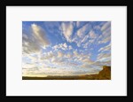 Cumulus Clouds Over Sandstone Buttes at Sunrise by Anonymous