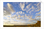 Cumulus Clouds Over Sandstone Buttes at Sunrise by Anonymous