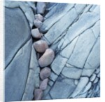 Rocks Against Cracked Boulder by Anonymous