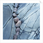 Rocks Against Cracked Boulder by Anonymous
