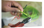 Electrician Stripping Electrical Wire by Anonymous