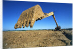 Backhoe Working in Muddy Field by Anonymous