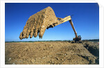 Backhoe Working in Muddy Field by Anonymous