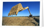 Backhoe Working in Muddy Field by Anonymous