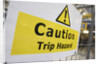 Caution Trip Hazard Sign on Construction Site by Anonymous
