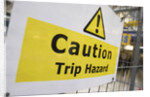 Caution Trip Hazard Sign on Construction Site by Anonymous