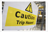 Caution Trip Hazard Sign on Construction Site by Anonymous