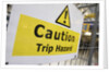 Caution Trip Hazard Sign on Construction Site by Anonymous