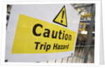 Caution Trip Hazard Sign on Construction Site by Anonymous