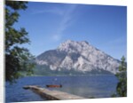Wooden Boat Tied to Dock on Lake by Anonymous
