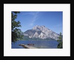 Wooden Boat Tied to Dock on Lake by Anonymous