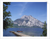 Wooden Boat Tied to Dock on Lake by Anonymous