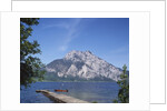 Wooden Boat Tied to Dock on Lake by Anonymous
