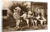 Poodle and Five Dogs Standing on their Hind Legs in a Line by Anonymous
