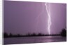 Lightning Striking near Lake by Corbis