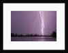 Lightning Striking near Lake by Corbis