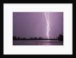 Lightning Striking near Lake by Corbis