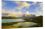 Mountains Shrouded in Clouds near Lake by Anonymous