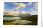 Mountains Shrouded in Clouds near Lake by Anonymous