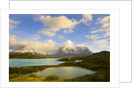 Mountains Shrouded in Clouds near Lake by Anonymous