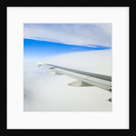 Airplane Wing Above Clouds by Anonymous
