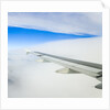 Airplane Wing Above Clouds by Anonymous