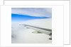 Airplane Wing Above Clouds by Anonymous