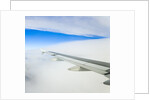 Airplane Wing Above Clouds by Anonymous