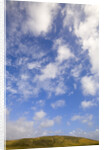 Cumulus Clouds above Hill by Anonymous