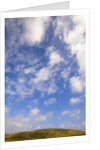 Cumulus Clouds above Hill by Anonymous