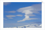 Lenticular Clouds Floating above Snow-covered Glacier by Anonymous
