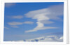 Lenticular Clouds Floating above Snow-covered Glacier by Anonymous
