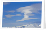 Lenticular Clouds Floating above Snow-covered Glacier by Anonymous
