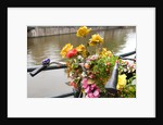 Bicycle with Flowers Beside a Canal by Anonymous