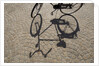 Bicycle Shadow on Cobblestone by Anonymous