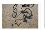 Bicycle Shadow on Cobblestone by Corbis