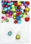 Christmas ornaments on snow by Anonymous