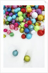 Christmas ornaments on snow by Anonymous