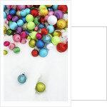 Christmas ornaments on snow by Anonymous