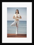 Woman doing yoga by the ocean by Anonymous