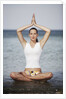 Woman meditating in the ocean by Anonymous