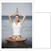 Woman meditating in the ocean by Anonymous