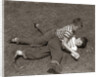 1950s Two Boys Wear Tee Shirts Blue Jeans Playing Rough Fighting Wrestling On The Grass by Anonymous
