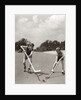 1930s 1940s 2 Boys With Sticks And Puck Wearing Roller Skates Playing Street Hockey by Anonymous
