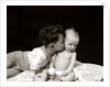 1940s Curly Haired Boy Toddler Leaning And Kissing Cute Baby by Anonymous