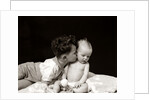 1940s Curly Haired Boy Toddler Leaning And Kissing Cute Baby by Anonymous