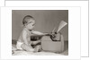 1960s Businesslike Baby With Pencil Behind Ear Typing On Typewriter by Anonymous