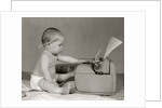 1960s Businesslike Baby With Pencil Behind Ear Typing On Typewriter by Anonymous