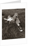 1960s Boy Sleeping In Grass Legs Crossed Holes In Sneakers Baseball Mitt By His Side by Anonymous