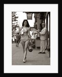 1970s Man Ogling Sexy Young Woman Walking Down City Street Wearing Only A Bikini by Anonymous